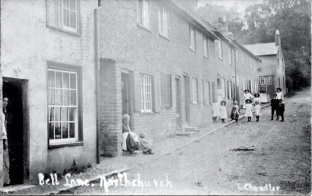 Workers outside Bell lane Cottages
